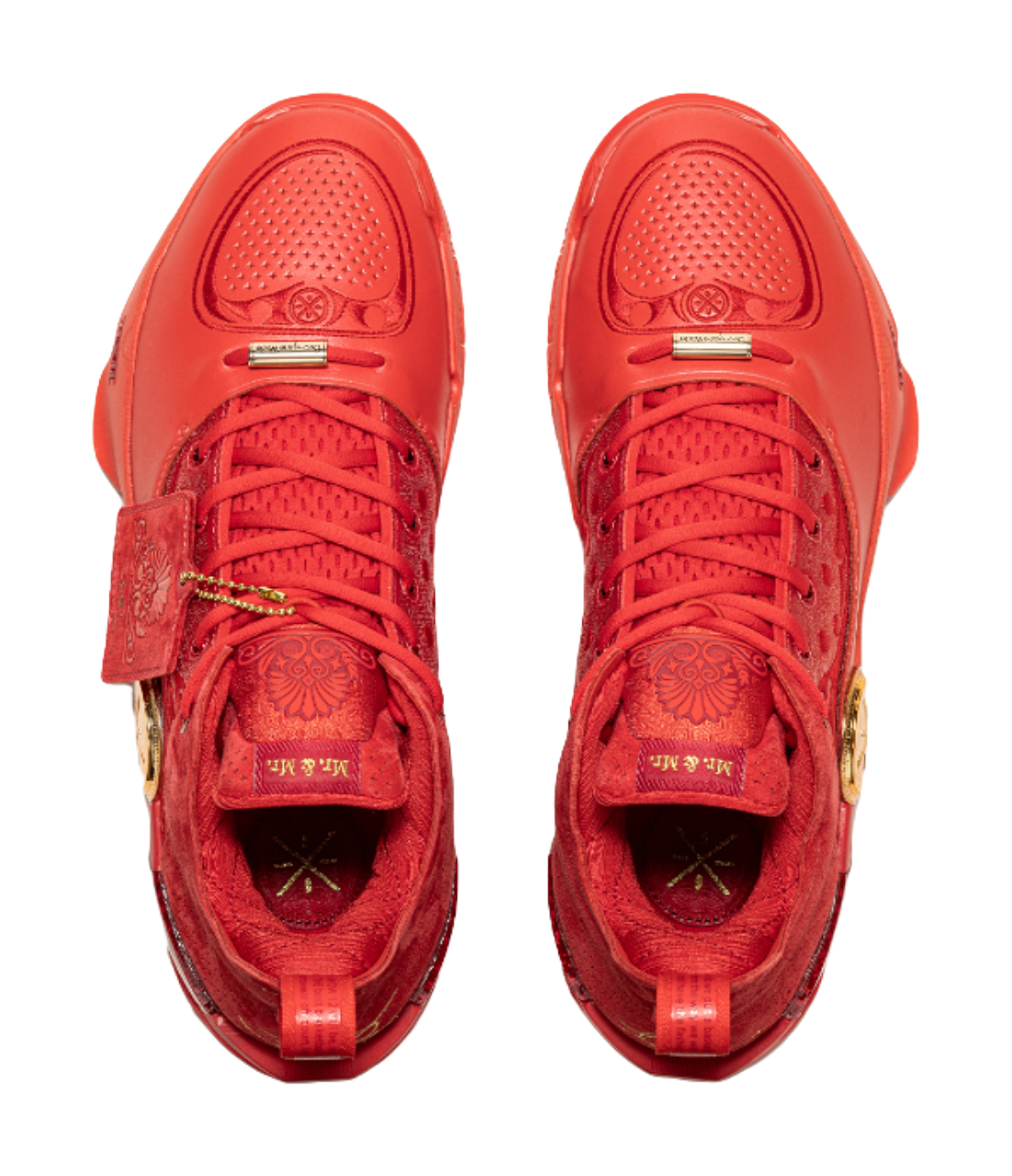 Pair of red lace-up basketball shoes with padded tongues and textured uppers.