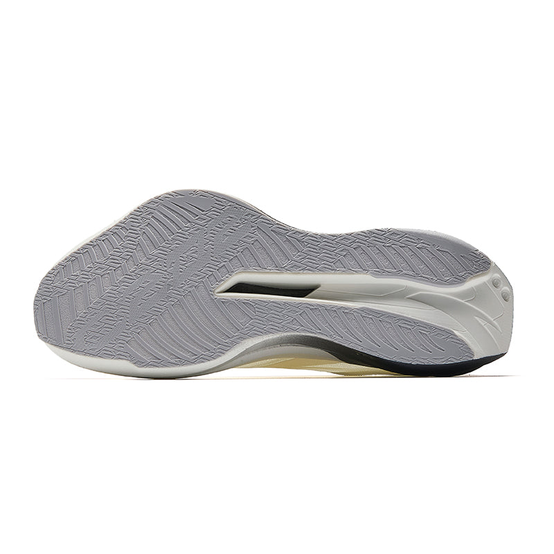 White running shoe outsole with textured gray tread and dark edge trim