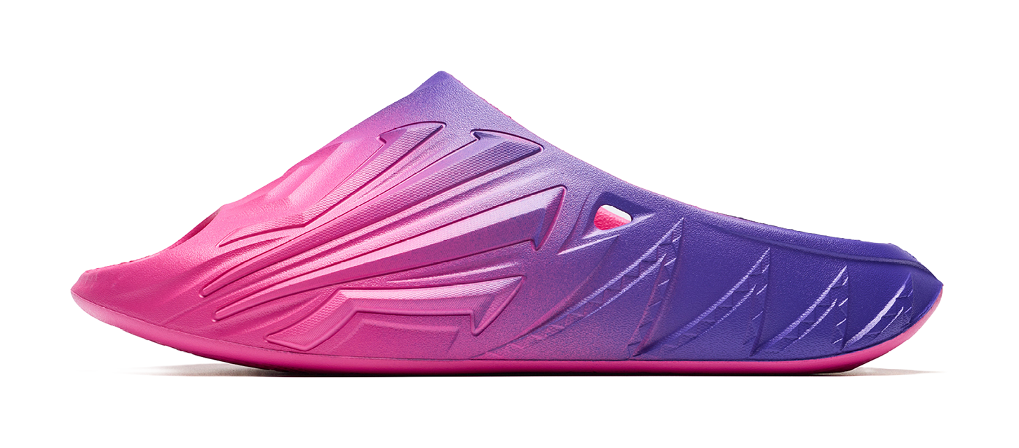 Unisex slide sandal with pink-to-purple gradient and molded logo side detail