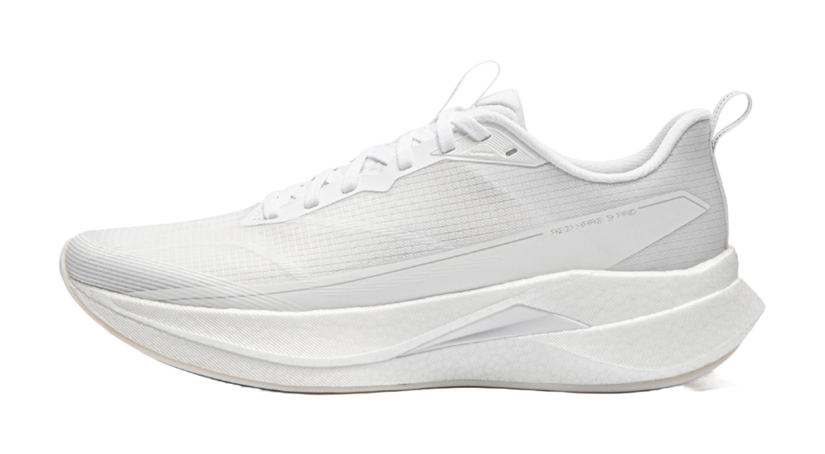 White running shoe with lace-up upper, textured panels, and thick cushioned sole