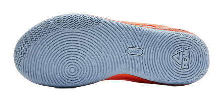 Light blue outsole of orange basketball shoe with tread and logo marks