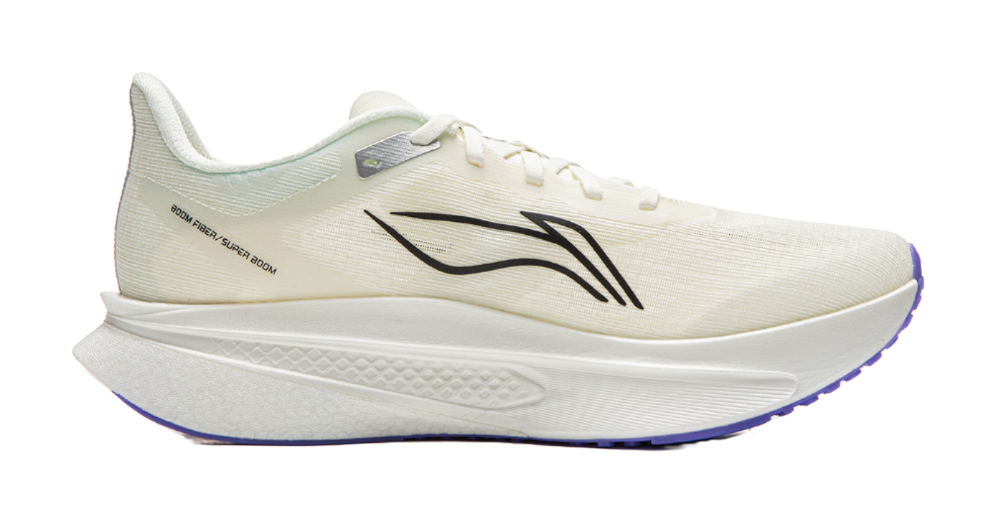 Champagne white running shoe side view with black branding and cushioned midsole