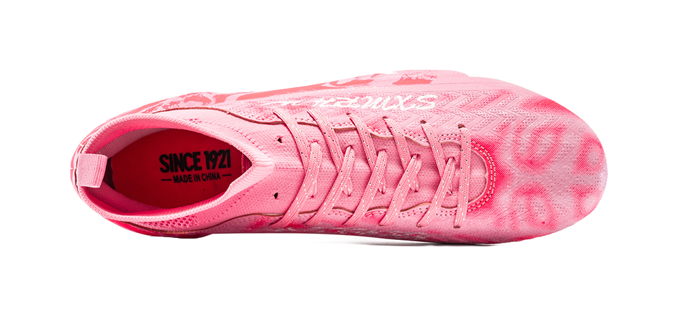 Pink soccer cleat toe view with lace-up vamp and cushioned collar