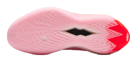 Pink outsole of basketball shoe with diamond traction pattern and red logo accents