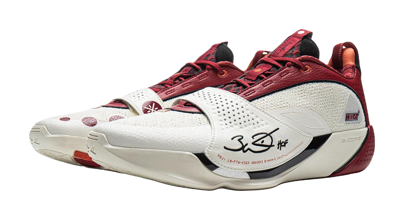 Red and white basketball shoe with laced front and white midsole with logos