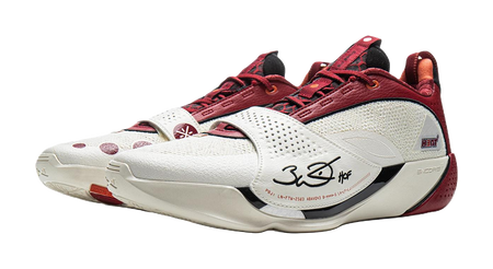 Red and white basketball shoe with laced front and white midsole with logos