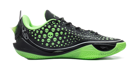 Black low basketball shoe with neon green trim, skull-dot upper, and textured sole