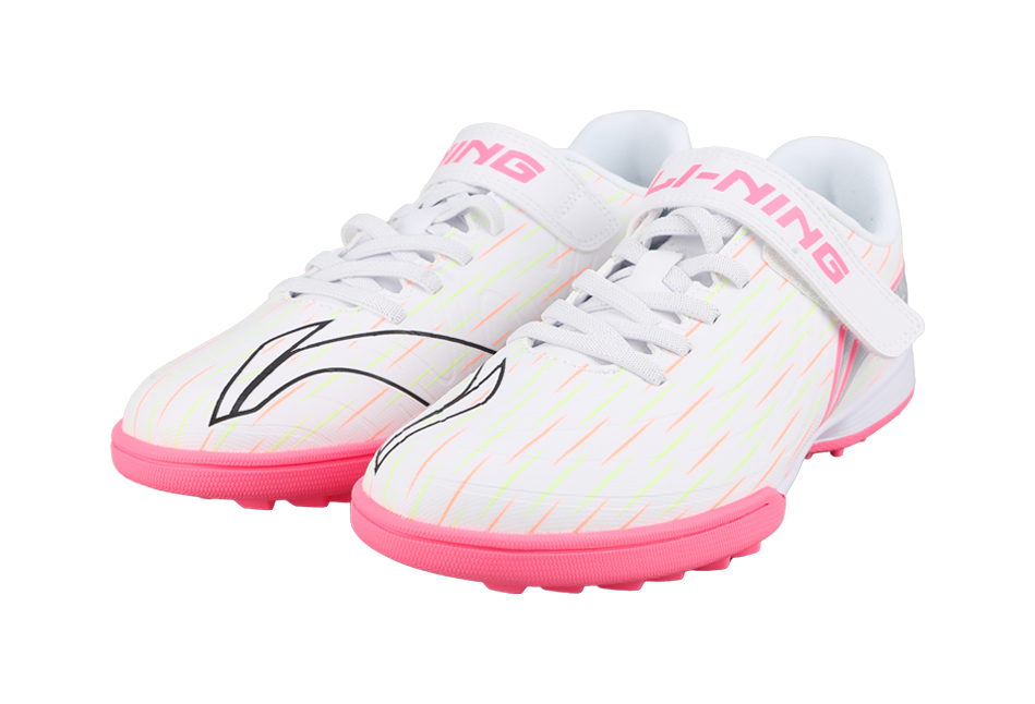 Pair of youth turf soccer shoes, white uppers with pink soles and Velcro straps