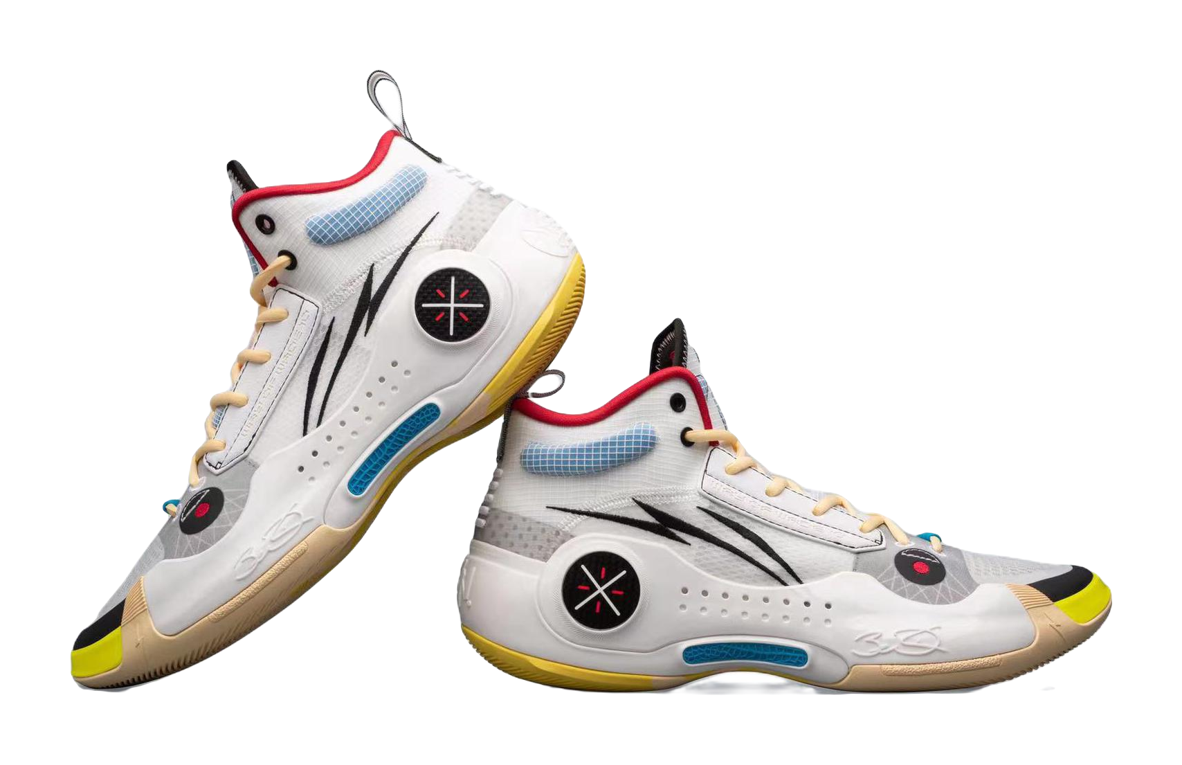 White mid-top basketball sneakers side-by-side, black logo, red collar, blue accents, yellow sole