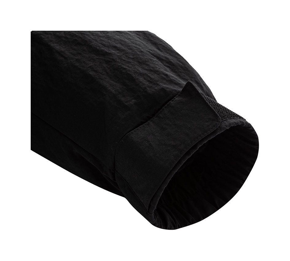 Black jacket sleeve cuff and hem detail with dark textured lining.