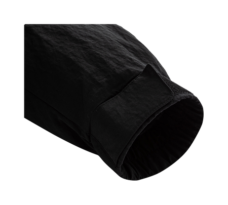 Black jacket sleeve cuff and hem detail with dark textured lining.