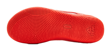 Orange-red rubber outsole with textured tread and traction pattern, bottom view.