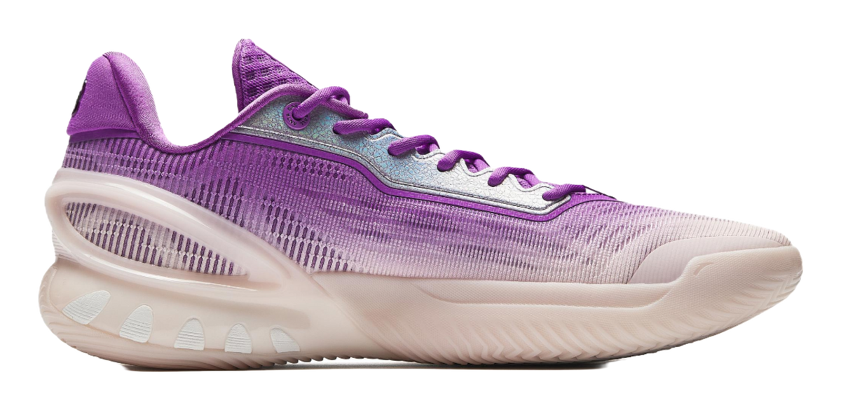 Purple and white basketball shoe side profile with textured knit upper and laces