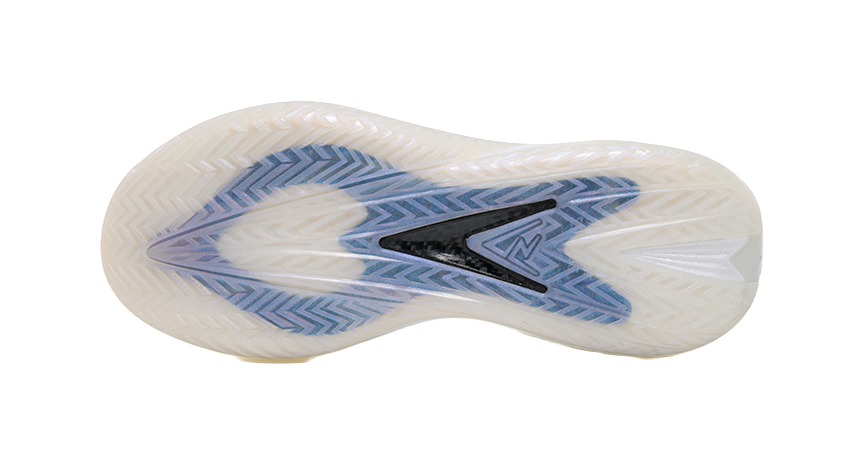 White shoe outsole with blue traction pattern and molded grooves