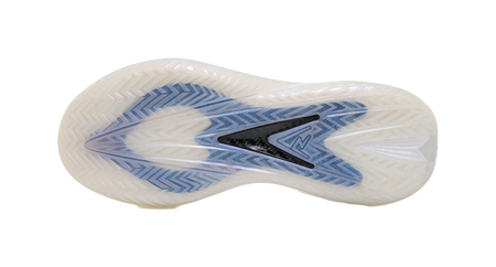 White shoe outsole with blue traction pattern and molded grooves