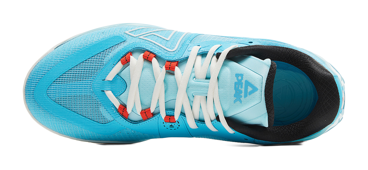 Blue basketball shoe with white laces, black interior collar, and light-blue sole edge