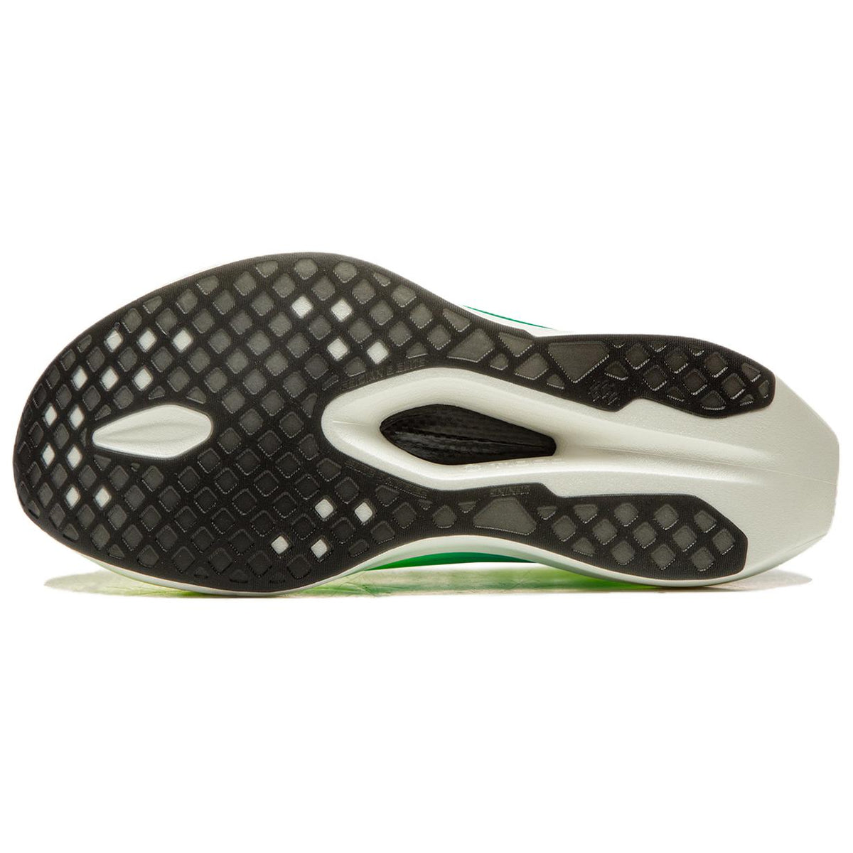 Racing shoe outsole with black traction pattern, white pods, green edge.