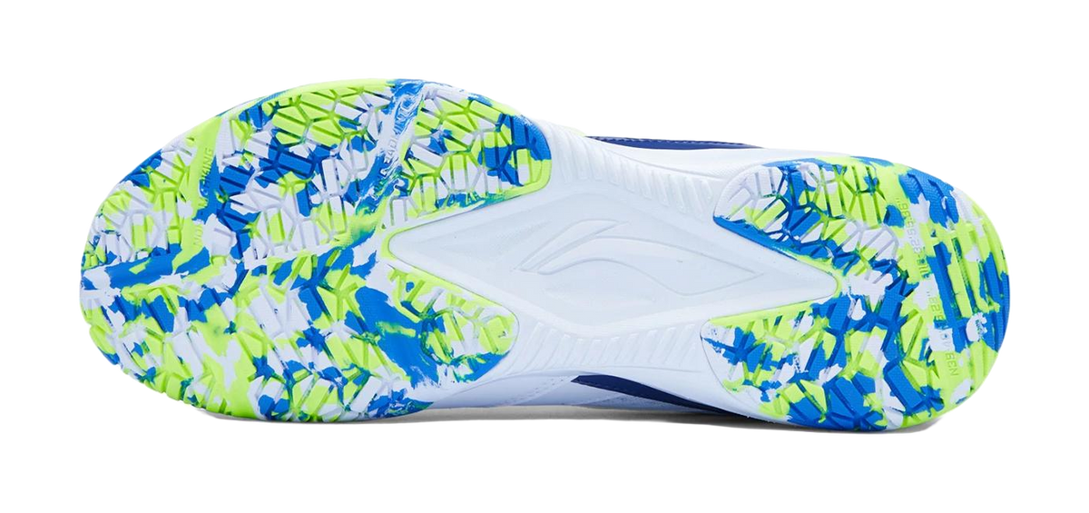 Badminton shoe outsole with white base and blue-neon green pattern grip