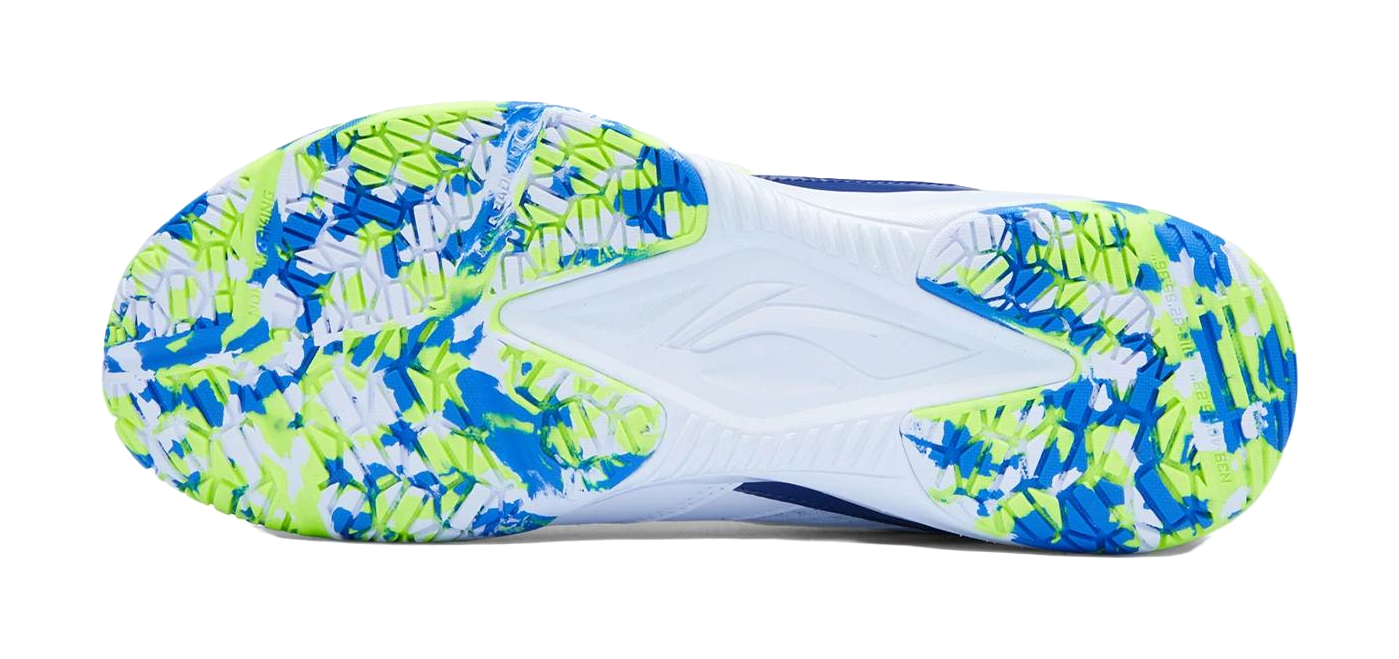 Badminton shoe outsole with white base and blue-neon green pattern grip