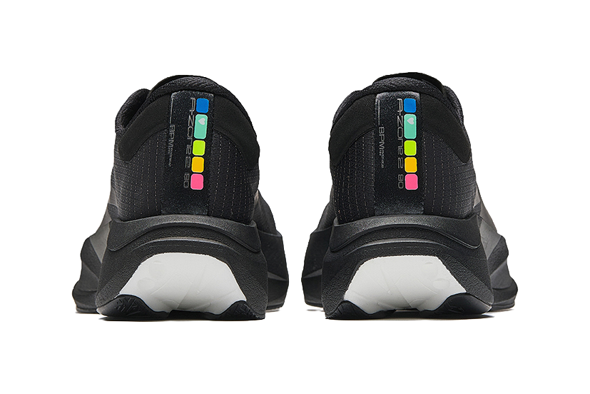 Black running shoes, rear view with padded heel collars and multicolor logo strip