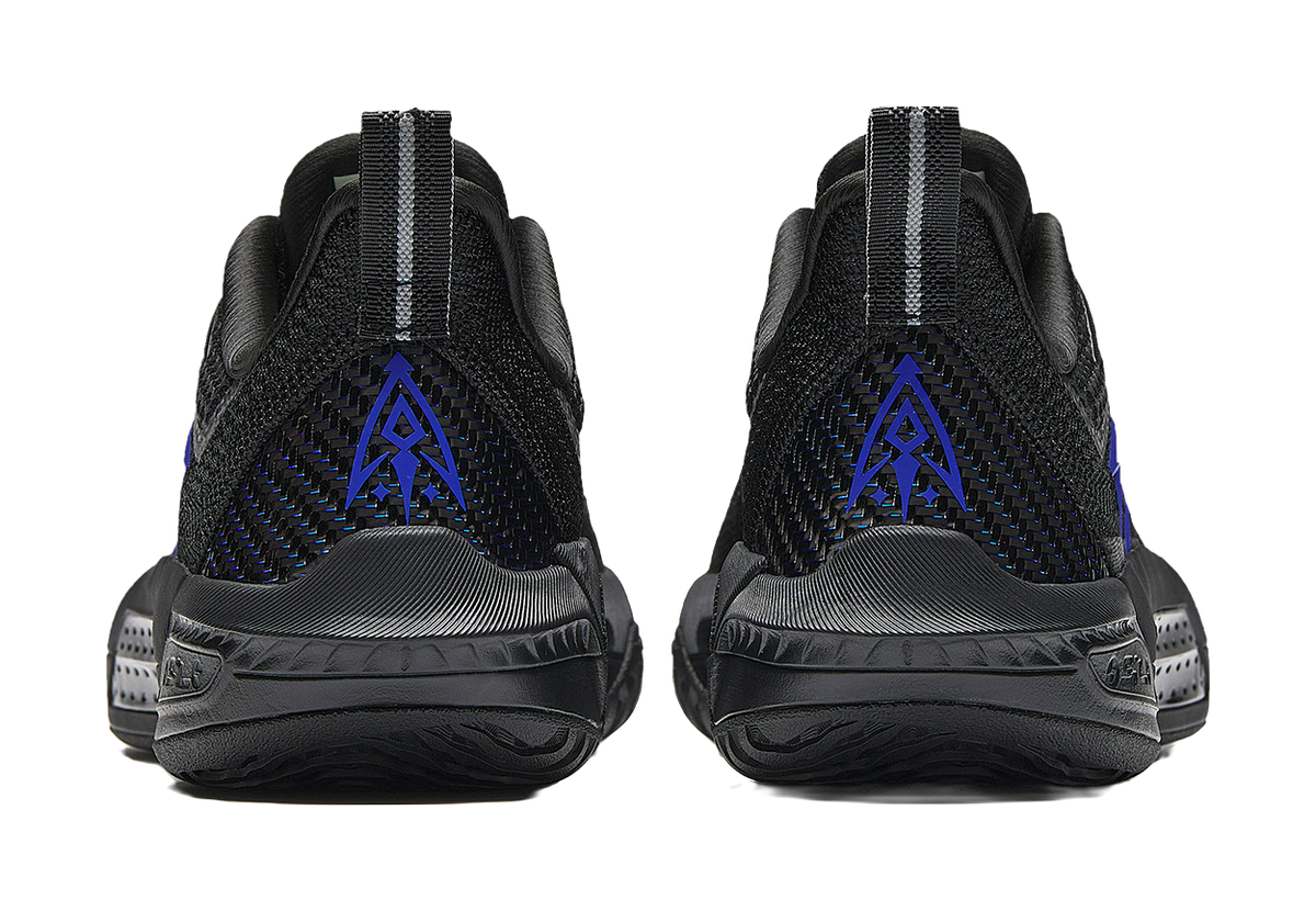 Black basketball shoes from back view with blue logo detail and reflective heel stripes
