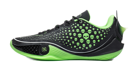 Low basketball shoe in black with neon green skull dot print and stripe sole