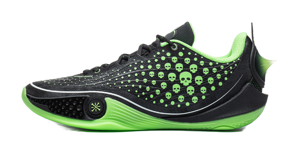 Low basketball shoe in black with neon green skull dot print and stripe sole