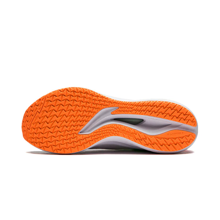 Men's running shoe outsole with orange tread pattern and gray midsole edge