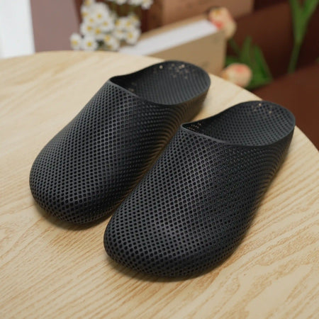 Black 3D printed slip-on slippers with textured mesh and cushioned sole