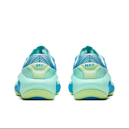 A pair of chunky platform sneakers shown from the back, featuring a light blue and mint green design with a bright yellow-green outsole accent, displayed on a white background within a mobile app screenshot.
