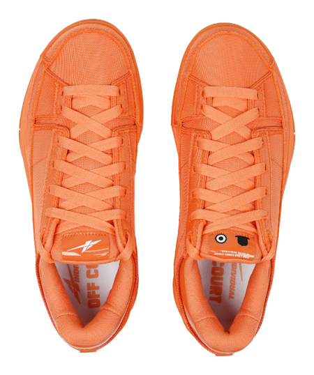 Orange lace-up basketball shoes, front view with cushioned tongue