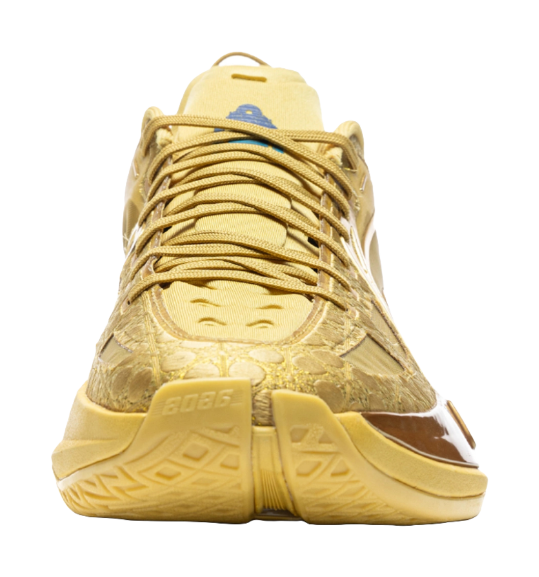 Bright gold low-top basketball shoes with lace-up front and blue insole detail