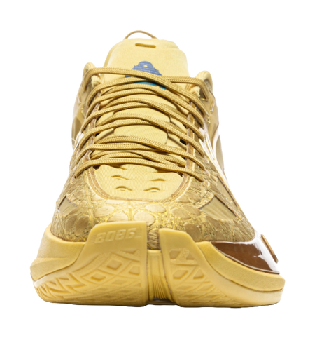 Bright gold low-top basketball shoes with lace-up front and blue insole detail