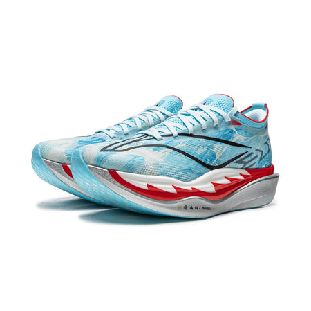 Unisex carbon plate running shoe in blue and white with red sole edge, angled view