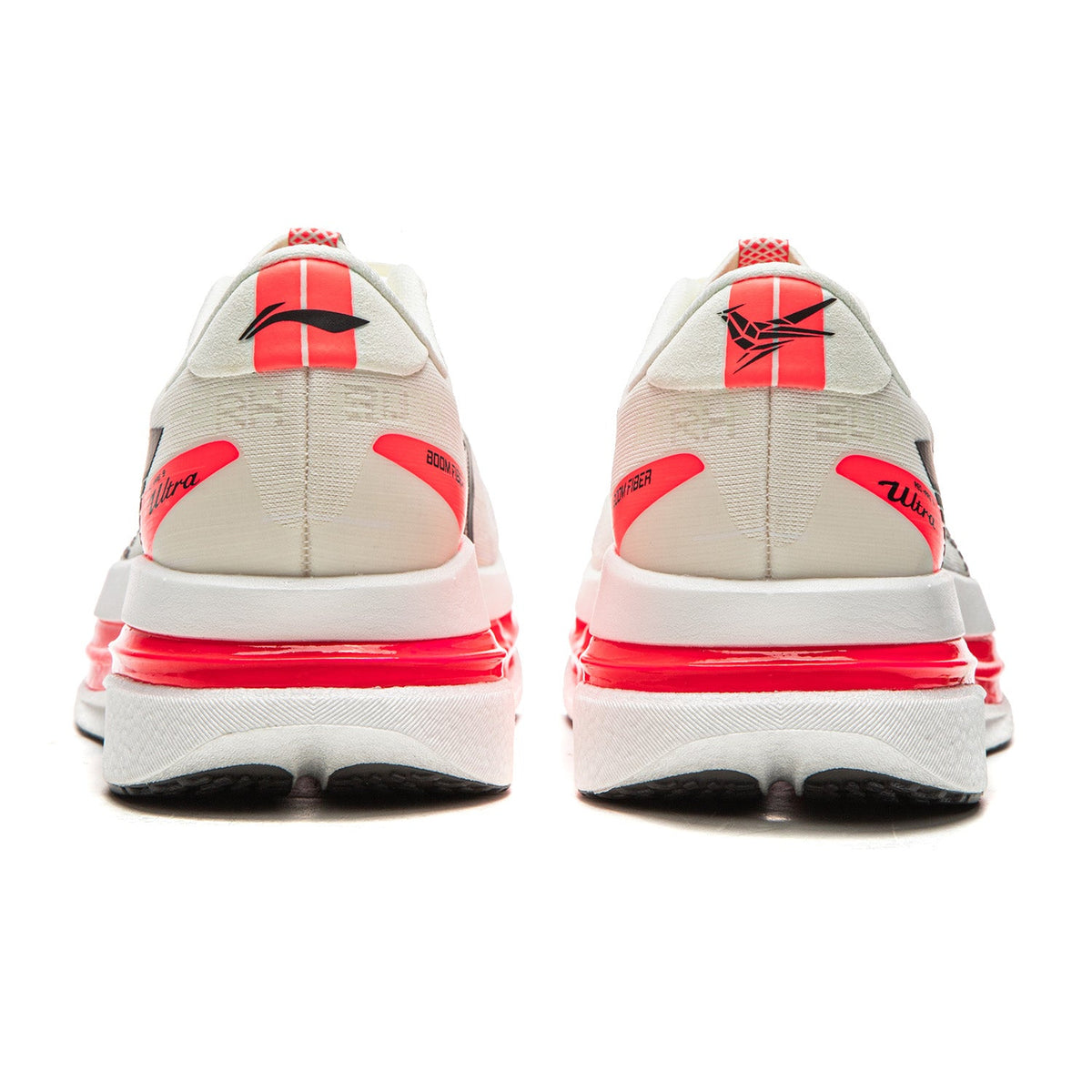 Champagne white running shoes pair with red heel stripe and black side logo, rear view