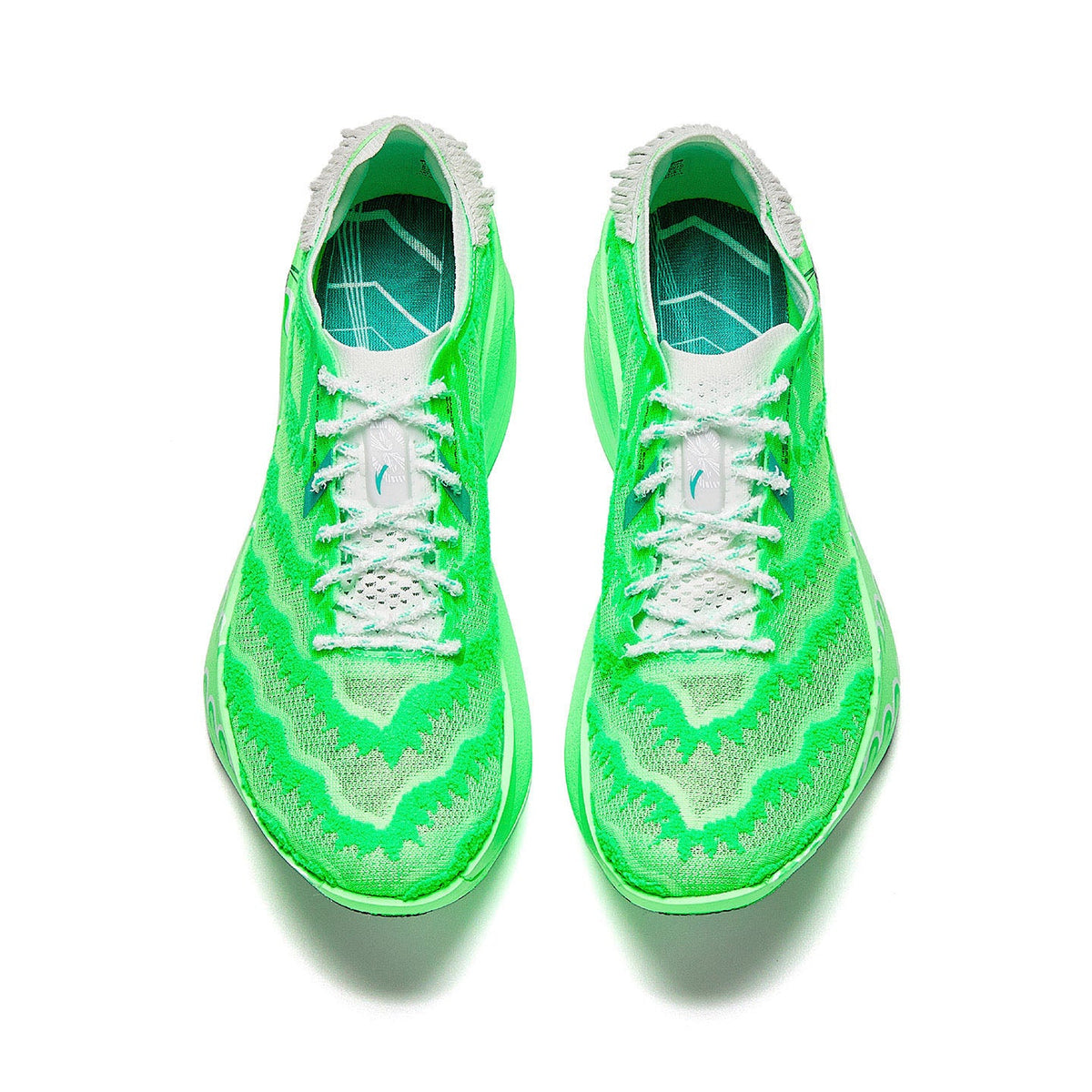 Marathon racing shoe pair, flash green knit upper with white laces, top view.