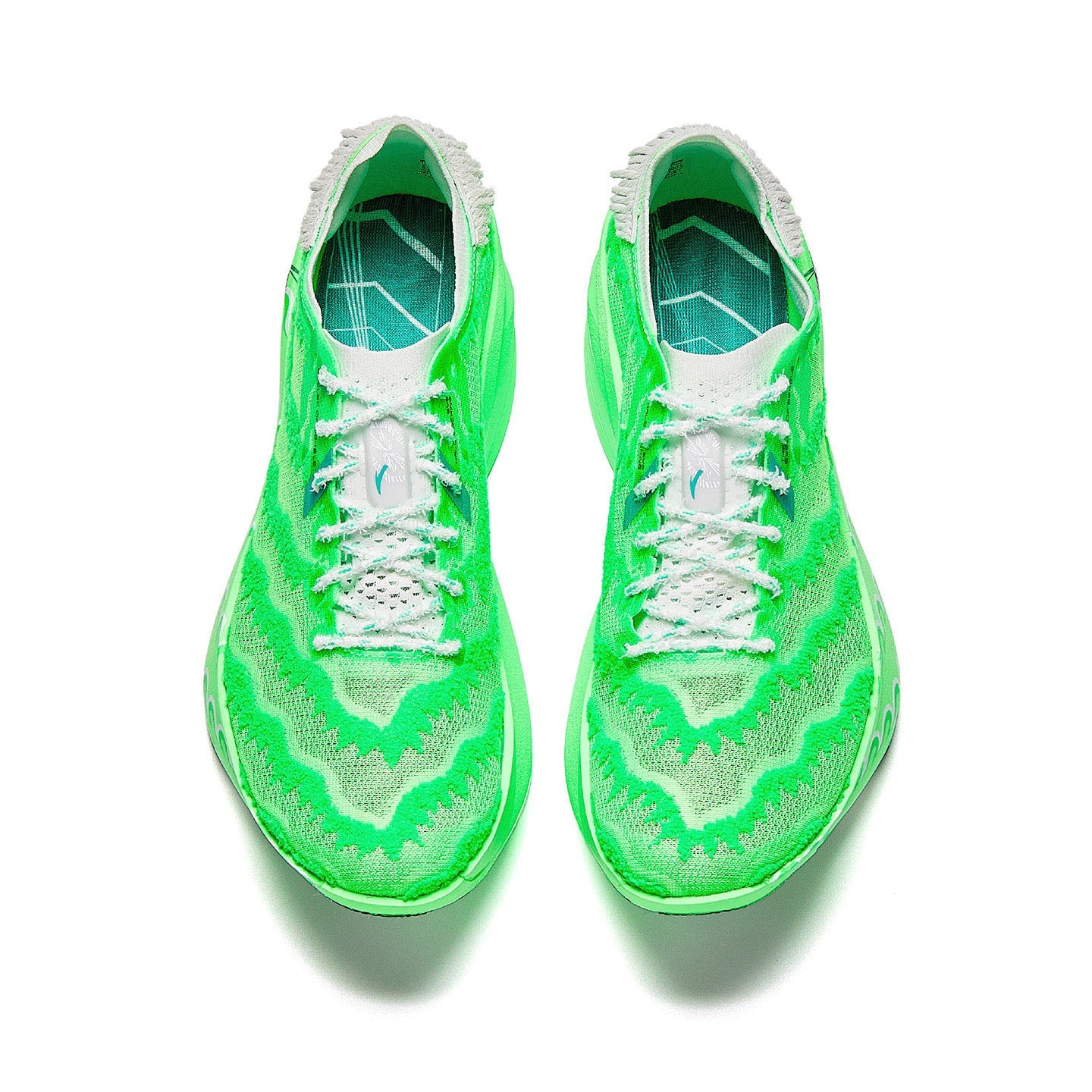 Marathon racing shoe pair, flash green knit upper with white laces, top view.