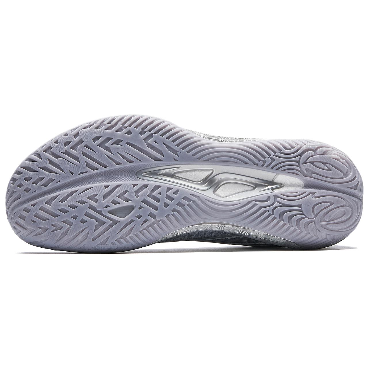 Men's basketball shoe outsole in silver-gray, rubber tread pattern with lateral traction
