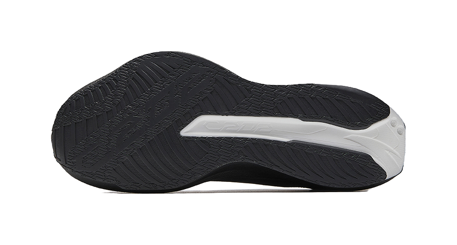 Black outsole with white traction stripe and textured tread pattern