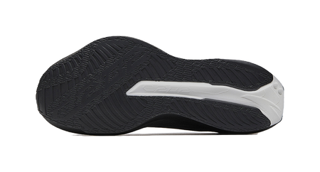 Black outsole with white traction stripe and textured tread pattern
