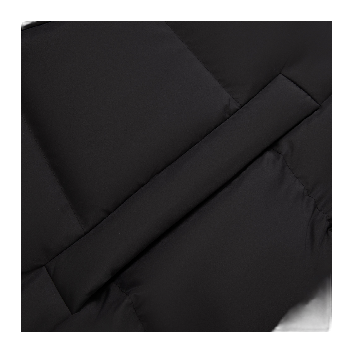 Black quilted down jacket close-up with diagonal seam and padded fabric stitching