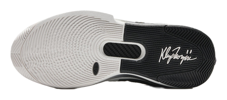 White basketball shoe outsole with tread pattern and signature-style logo