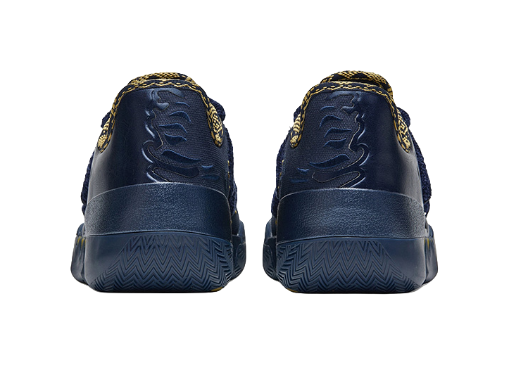 Back view of blue low-top basketball shoes with textured heel panels and gold details