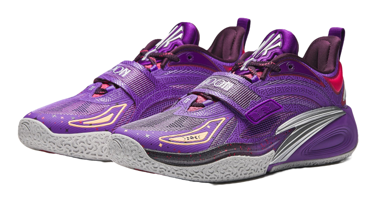 Purple basketball shoe pair with purple strap, red details, and textured gray sole.