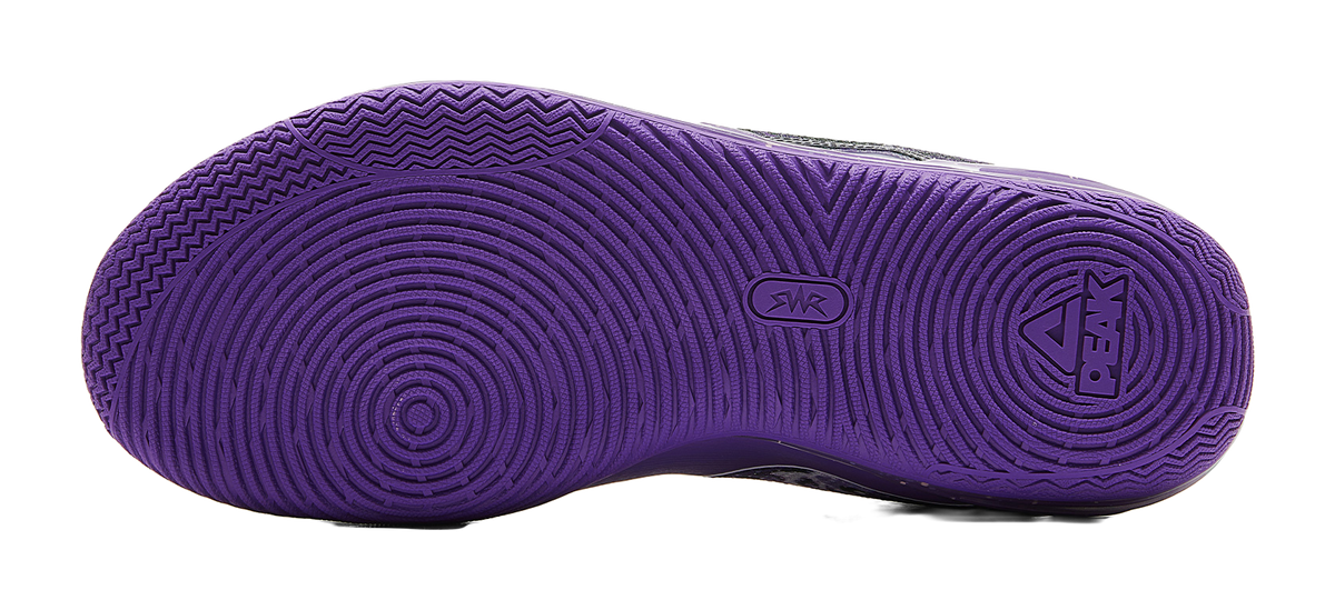 Lavender basketball shoe outsole with textured tread pattern