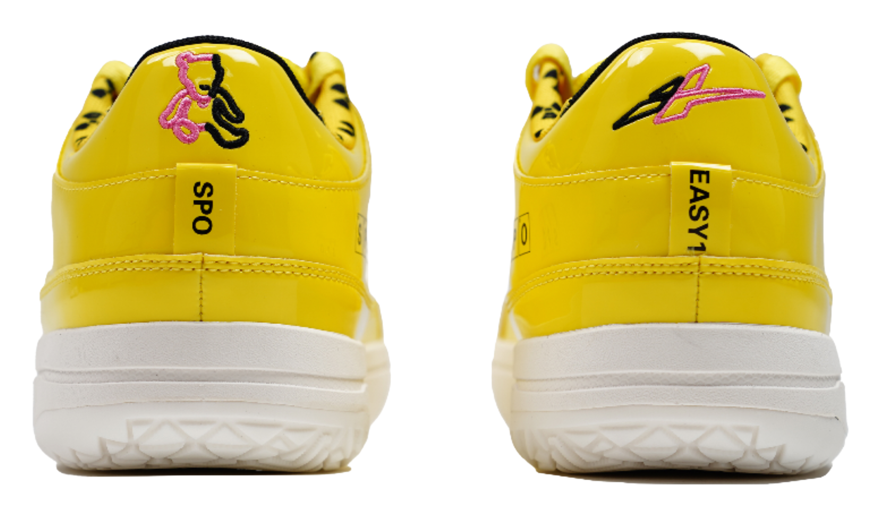 Yellow basketball shoes with heel pull tabs and white outsoles