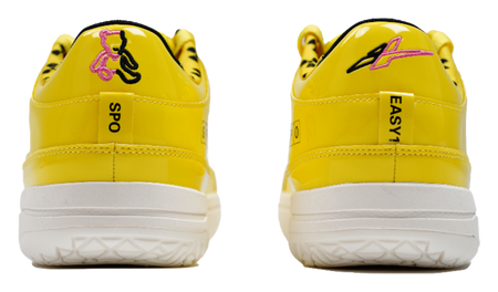 Yellow basketball shoes with heel pull tabs and white outsoles