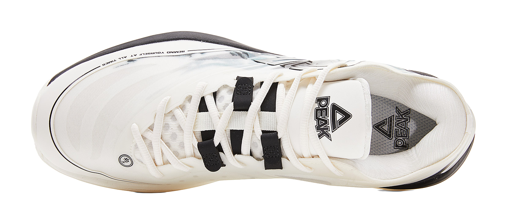 Lightweight basketball shoe, cream upper with black laces and interior logo patch