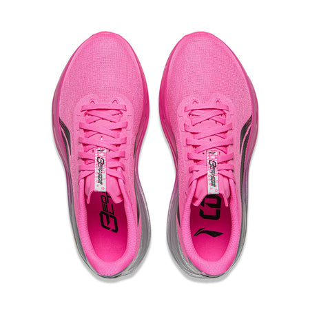 Pair of women's pink running shoes, lace-up tongues shown, gray interior accents