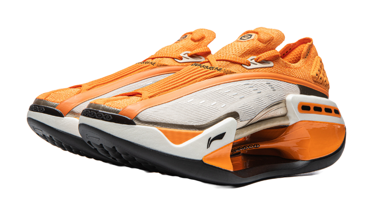 Orange Li-Ning Shadow running shoe angled view with white midsole and black tread outsole